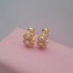Ladies gold earrings with small silver design