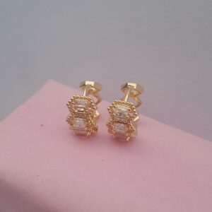 Ladies gold earrings with small silver design