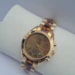 Ladies gold digital watch with brown line accent