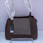 Women's structured handbag in coffee brown with herringbone textile panel and dual top handles — shop Pedra bags at Nansey Emporium Ghana